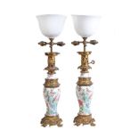 A pair of Chinese 'Famille Rose' gilt-metal mounted vases