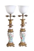 A pair of Chinese 'Famille Rose' gilt-metal mounted vases