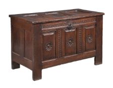 A Continental oak panelled oak chest or coffer