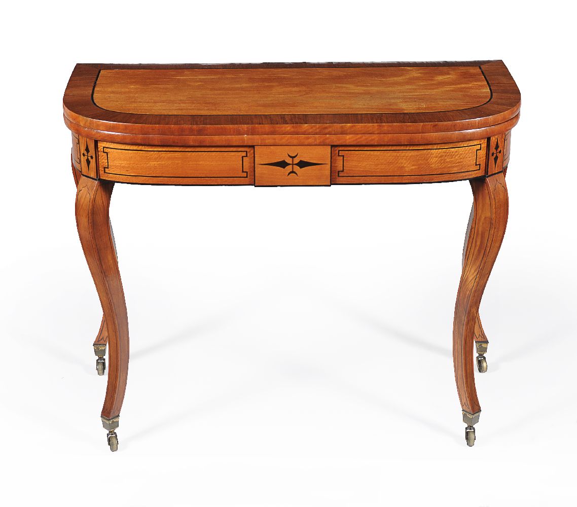 A Regency satinwood and ebonised inlaid folding card table