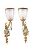 A pair of late Victorian gilt bronze, cut glass and porcelain inset wall lamps