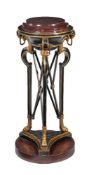 An ebonised, parcel gilt, and simulated porphyry torchere stand, in Regency style