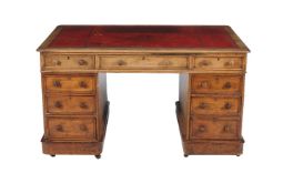 A Victorian walnut pedestal desk