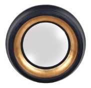 A giltwood and ebonised convex wall mirror in Regency style