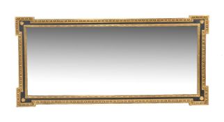 A rectangular ebonised and giltwood wall mirror