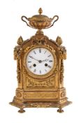 A giltmetal mantel clock in Louis XVI style