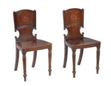 A pair of Regency mahogany hall chairs