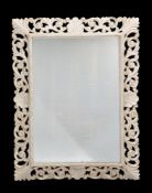 A white painted rectangular wall mirror in 17th century style