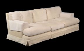 An upholstered three seat sofa