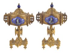 A pair of French gilt metal and enamel mounted side urns and covers in Gothic taste