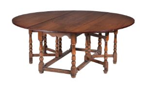 An oak gateleg dining table in 17th century style