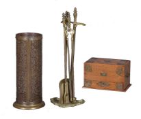 A brass fire iron companion stand in Belle Epoque Rococo Revival taste