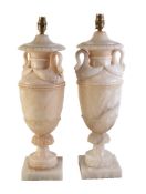 A pair of Continental turned and carved alabaster vase table lamps