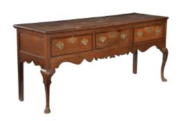 A George III oak and mahogany crossbanded dresser base