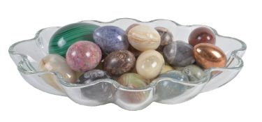 A collection of approximately 25 polished hardstone models of eggs