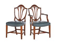 A set of twelve mahogany dining chairs in George III style