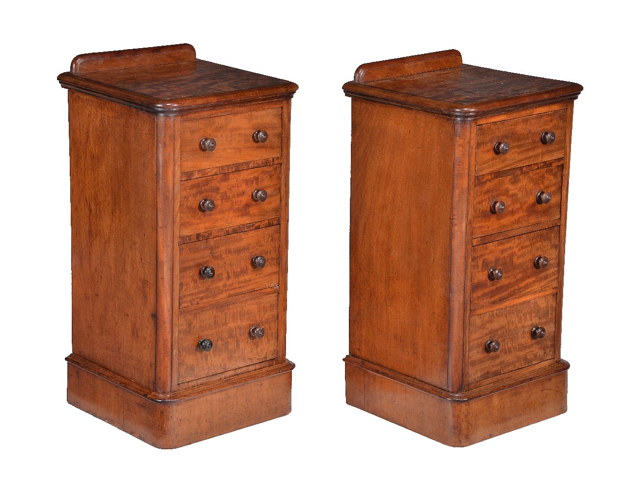 A pair of walnut bedside pedestal chests