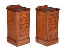 A pair of walnut bedside pedestal chests