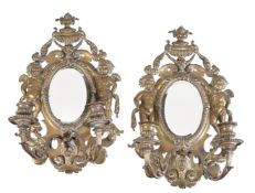 A pair of Continental, possibly Italian, gilt metal twin light girandoles, in 18th century taste