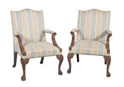 A pair of mahogany and upholstered armchairs