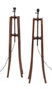 A pair of stained wood standard lamps