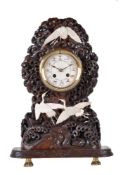 ϒ A French Japonisme stained hardwood mantel clock