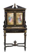 A French ebonised, gilt metal mounted and porcelain inset bonheur du jour