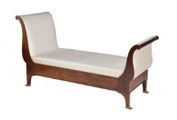 A mahogany and upholstered day bed in Empire style