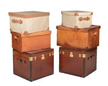 A pair of leather clad storage trunks