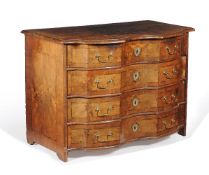 A Continental walnut serpentine fronted commode
