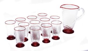 A modern clear and red glass spirally fluted lemonade set