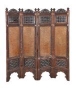 An Indian carved and pierced hardwood room screen