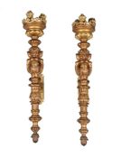 A pair of gilt bronze three light wall torcheres in Baroque taste