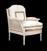 A white painted beech bergere armchair in Louis XVI style