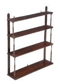 A flight of mahogany wall shelves