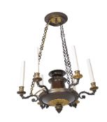 A French parcel gilt and patinated metal six light chandelier in the manner of early 19th century co
