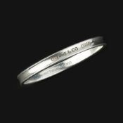 A silver bangle by Tiffany & Co.