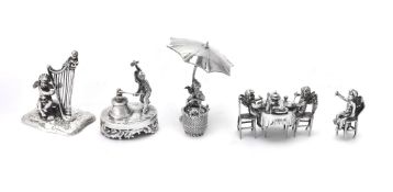 Five Continental silver toys with cherubs by Neresheimer: selling apples from a basket under an umbr