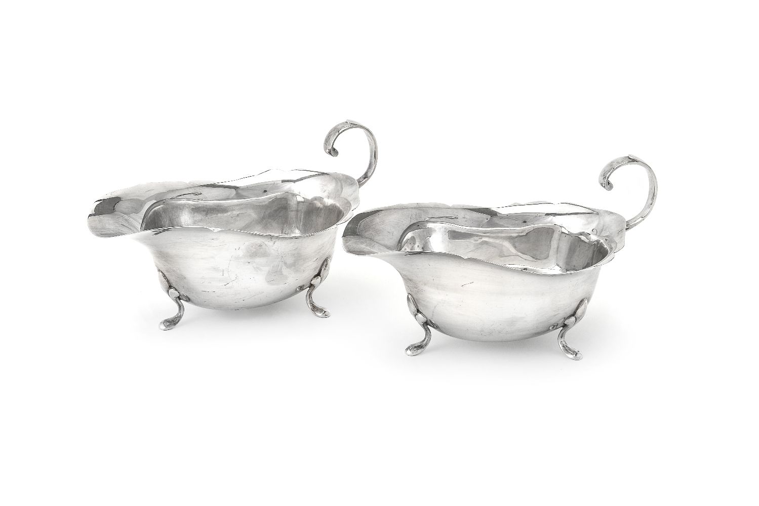 A pair of silver oval sauce boats by Sucking Ltd