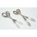 Two pairs of silver salad servers