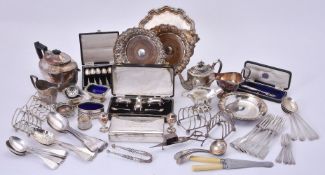 A collection of silver flatware and plated items