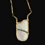 An 18 carat gold fluorite, pyrite, diamond, emerald, sapphire and mother of pearl pendant