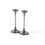 A pair of Greek silver coloured circular candlesticks by M. I. Armaos