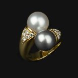 A cultured pearl and diamond ring