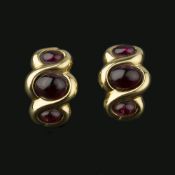 A pair of garnet earrings retailed by Annabel Jones