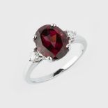 A garnet and diamond ring