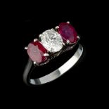 A three stone diamond and ruby ring