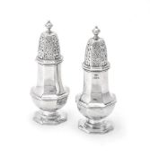 A matched pair of silver octagonal baluster sugar casters by Stokes & Ireland Ltd