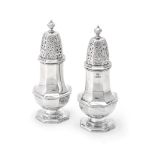 A matched pair of silver octagonal baluster sugar casters by Stokes & Ireland Ltd