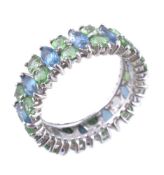 A natural blue and green stone eternity ring